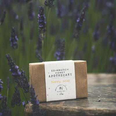 honey soap on the table with lavender farm at its background