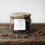 Bee bread in a glass jar, showing naturally fermented pollen granules