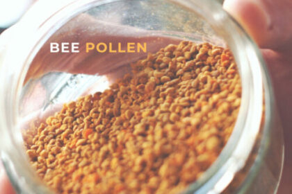 A jar of Bee Pollen held on its side with the open end facing the camera